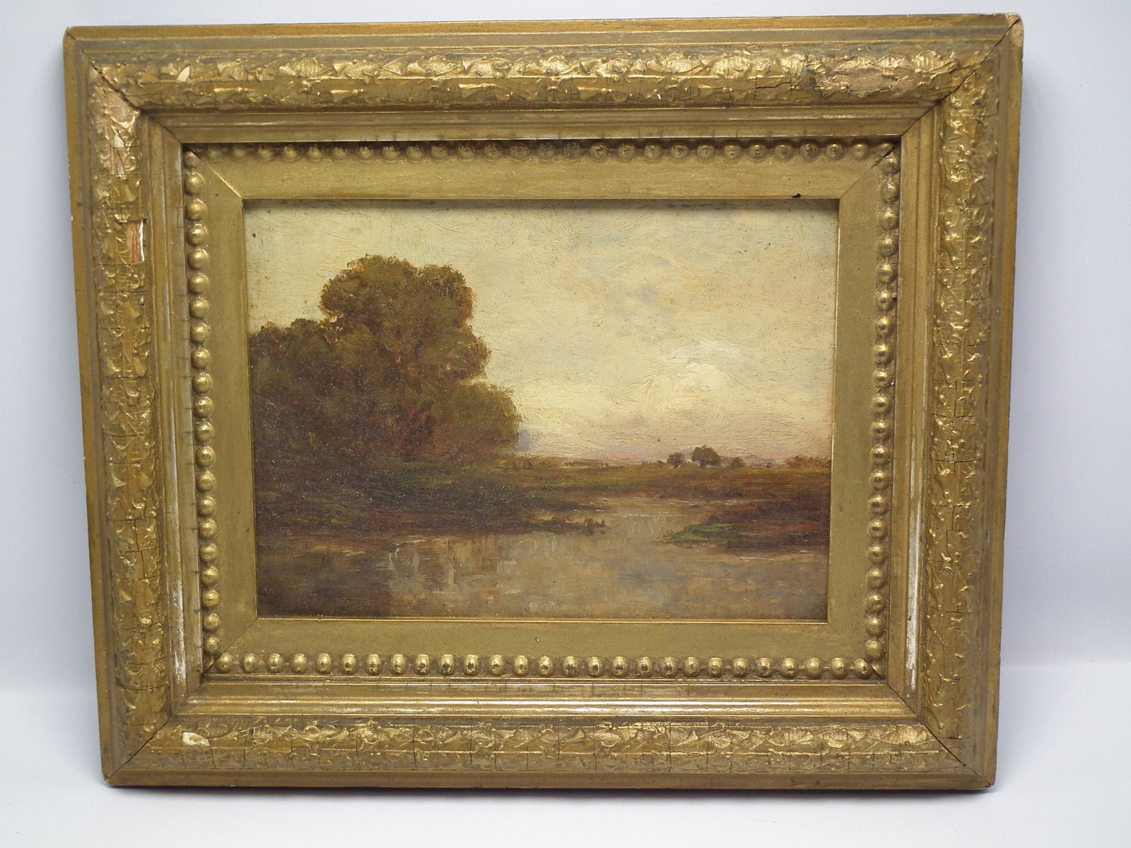 IMPRESSIONIST MARSH OIL PAINTING: Small antique oil painting of an impressionistic marsh scene with Boston label verso. Signed indistinctly in lower left, 8 x 10 inches, framed 10 x 12.