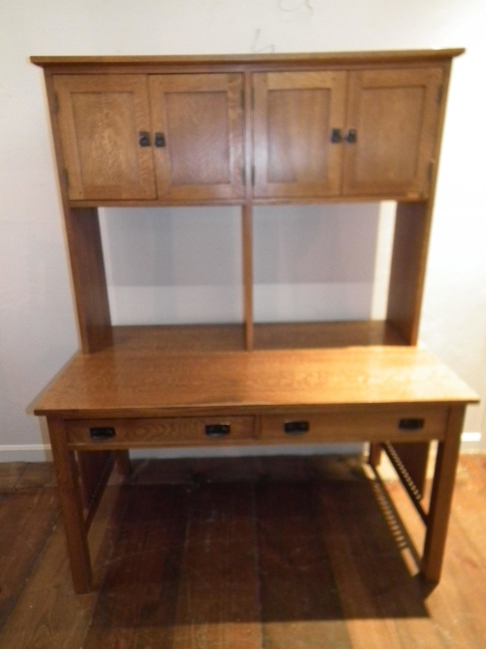 STICKLEY OAK DESK & HUTCH: Vintage Stickley oak 2 drawer office desk with upper 2 door hutch with total of 4 shelves (2 open shelved included, not shown). Top is removable. Signed with metal Stickley label. 54 in high x 30 x 40