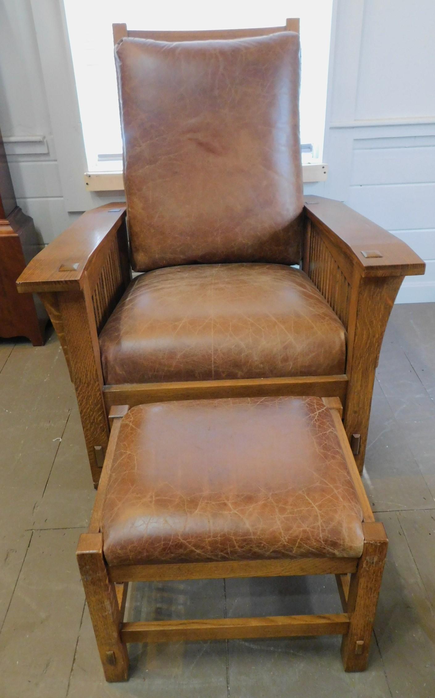 STICKLEY BENT ARM MORRIS CHAIR & OTTOMAN: Vintage Stickley golden oak bent arm Morris chair with leather upholstery and matching ottoman. Chair is 33 wide x 37.5 deep x 21 to top of arm. Adjustable back. Ottoman is 19 x 15 inches. Both signed