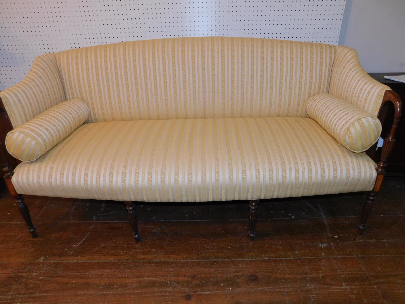 SHERATON STYLE SOFA: Custom mahogany Sheraton reeded leg sofa with band inlay and yellow striped upholstery. 6 ft long x 30 d x 37 inches high. Very clean with 2 bolster pillows.