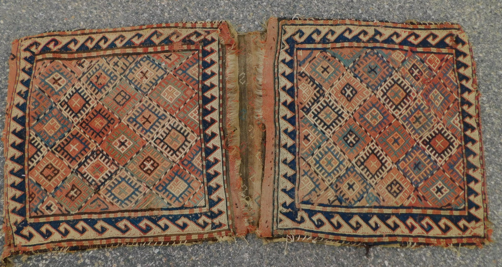 ANTIQUE KILIM SADDLE BAG: Antique Kilim two-sided saddle bag. 4 ft 3 inchex by 2 feet. Some minor scattered damage.