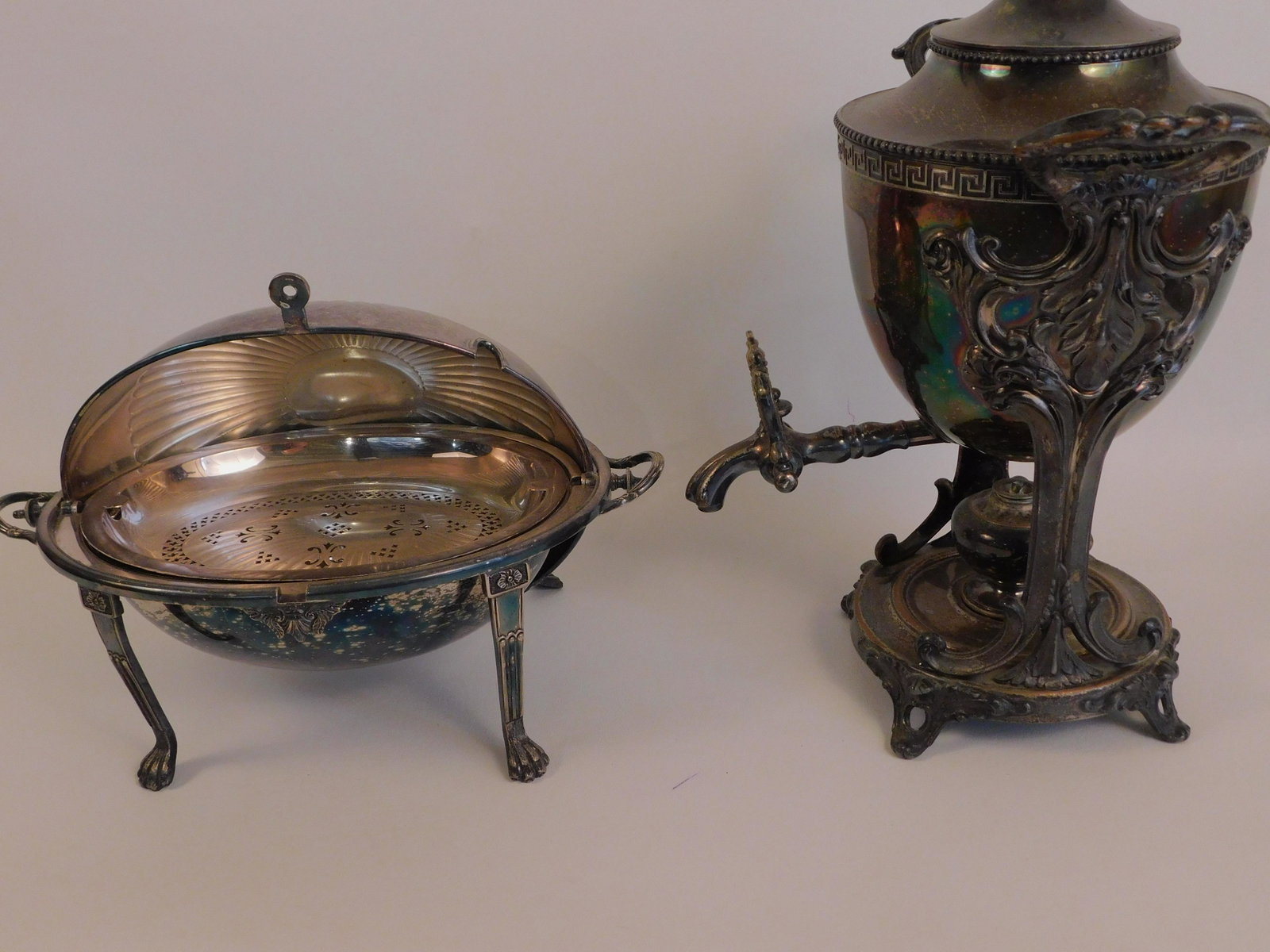 ANTIQUE ENGLISH KETTLE & BREAKFAST WARMER: Lot 2 antique English silver plated items: 13 inch revolving-dome breakfast server with interior trays and paw feet signed Goldsmiths and Silversmiths Regent Place; and a heavy 16 in James Dixon Sheff