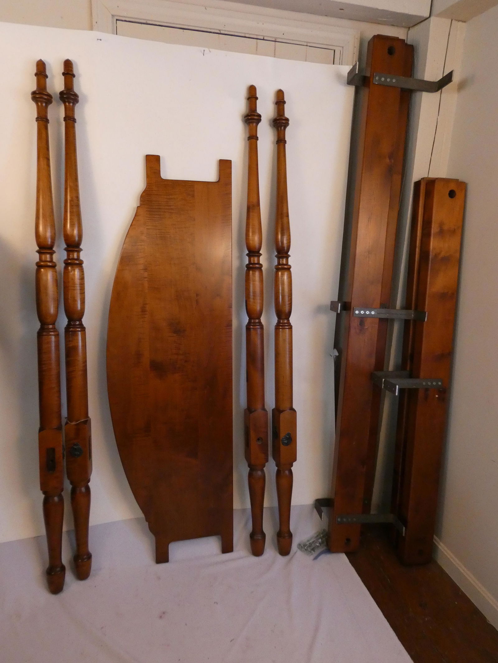 TIGER MAPLE QUEEN 4 POST BED: Fine quality modern, solid tiger maple queen size four poster bed with acorn finials, rails, headboard and screws (complete). Size: 66 inches wide. Posts are 75 inches tall. Mint condition, originally