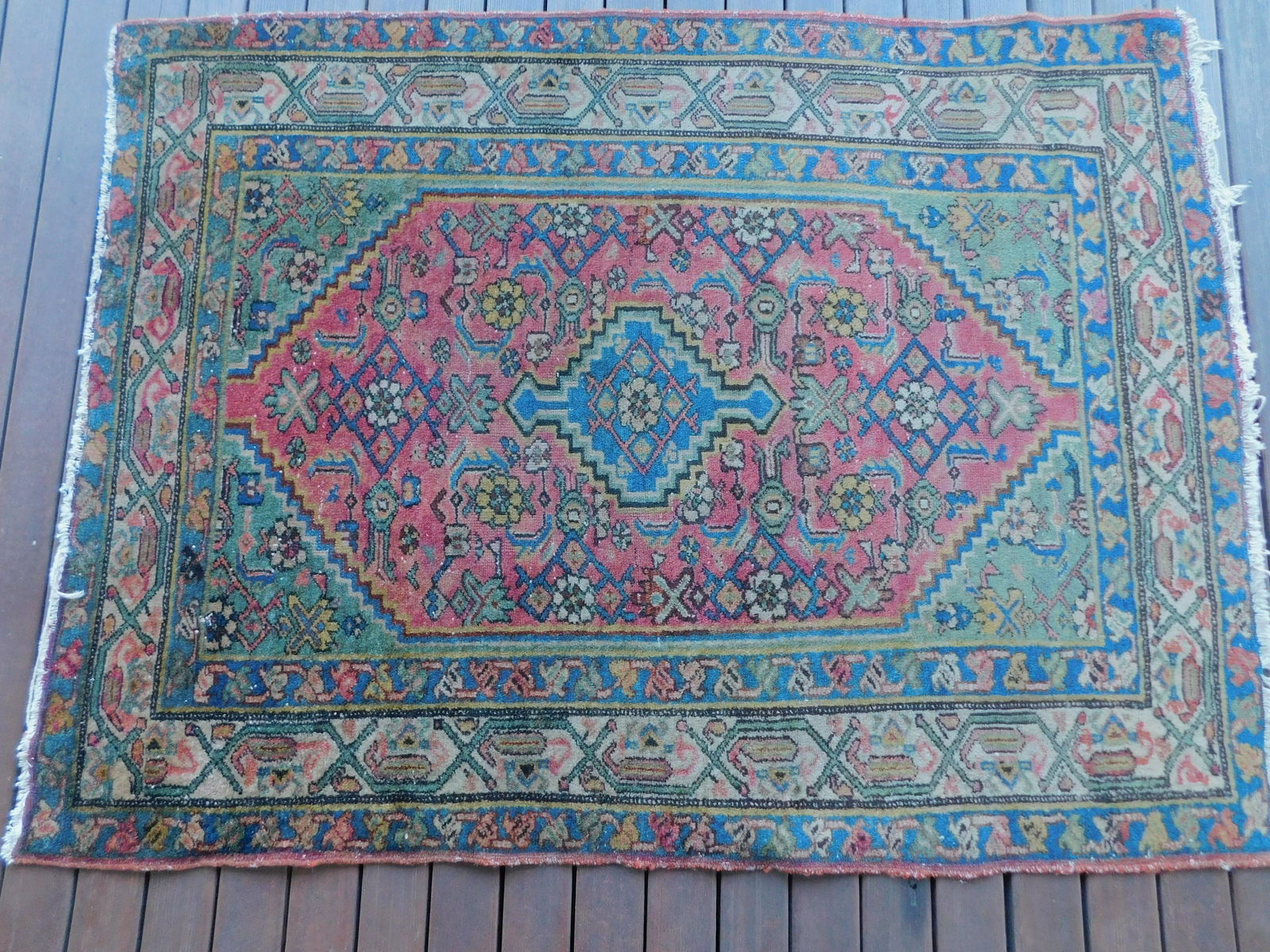 ANTIQUE HAMADAN RUG: Antique Persian Hamadan scatter rug with red and blue center medallion, 3 ft 6 inches by 4 ft 8 inches. Some even wear.