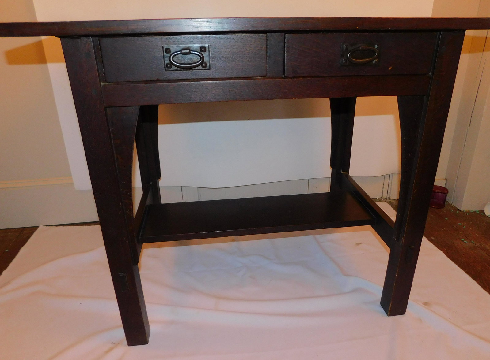 GUS STICKLEY OAK LIBRARY TABLE #613: Antique Gustav Stickley dark oak pegged small library table with 2 drawers and copper hammered handles, paper label on underside #613, red compass mark also, 30 in high by 36 x 24.5 inches. VG conditi