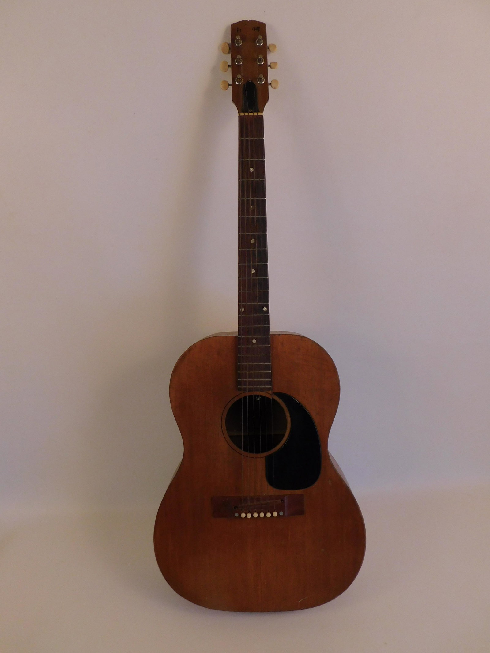 OLD GIBSON ACOUSTIC GUITAR: Antique Gibson acoustic guitar, 39.5 in long. Has warp/crack/wear to body. Comes with soft case.