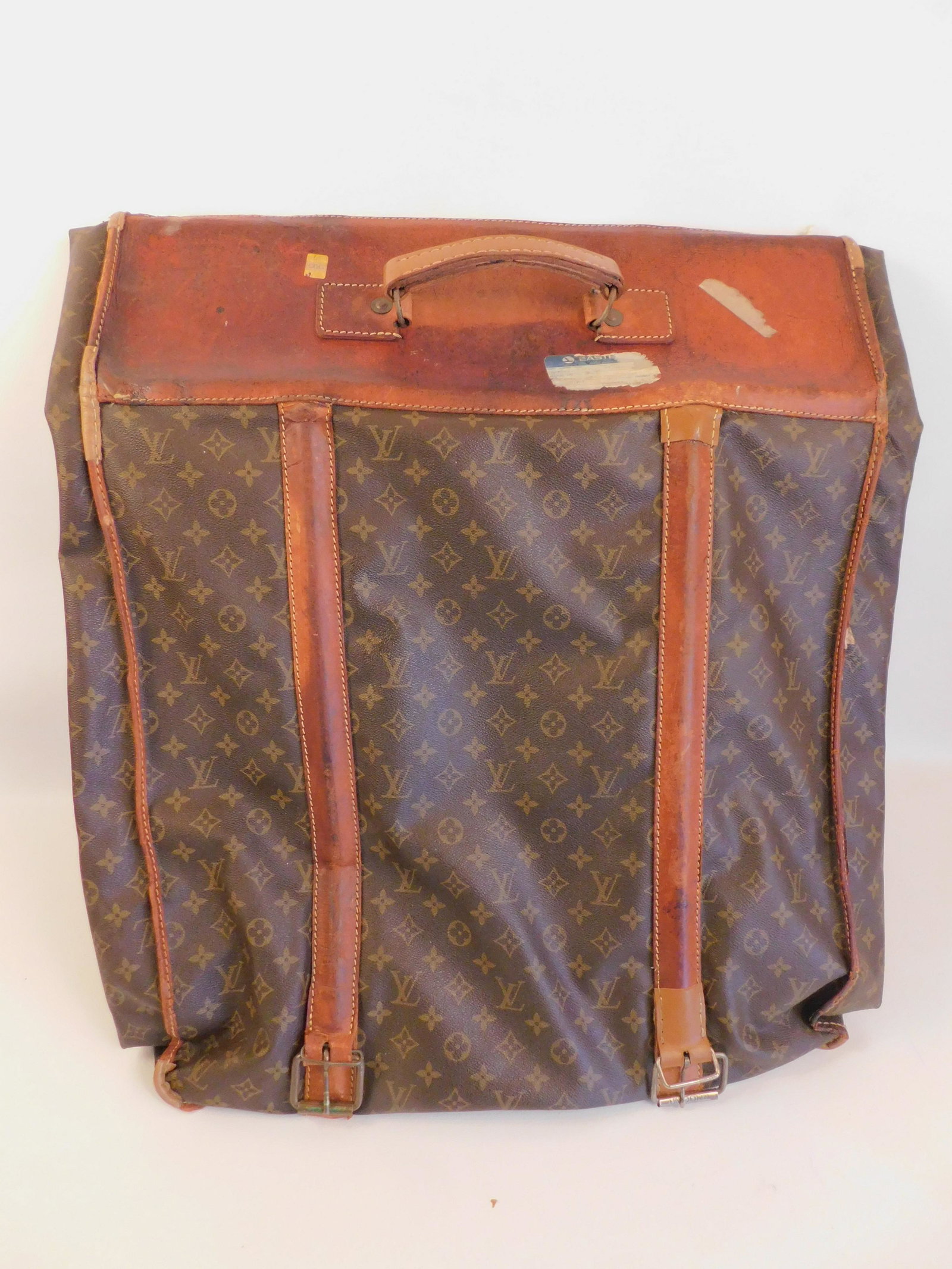 LOUIS VUITTON GARMENT BAG: Old Louis Vuitton logo garment bag, minor wear, 52 x 23 inches.