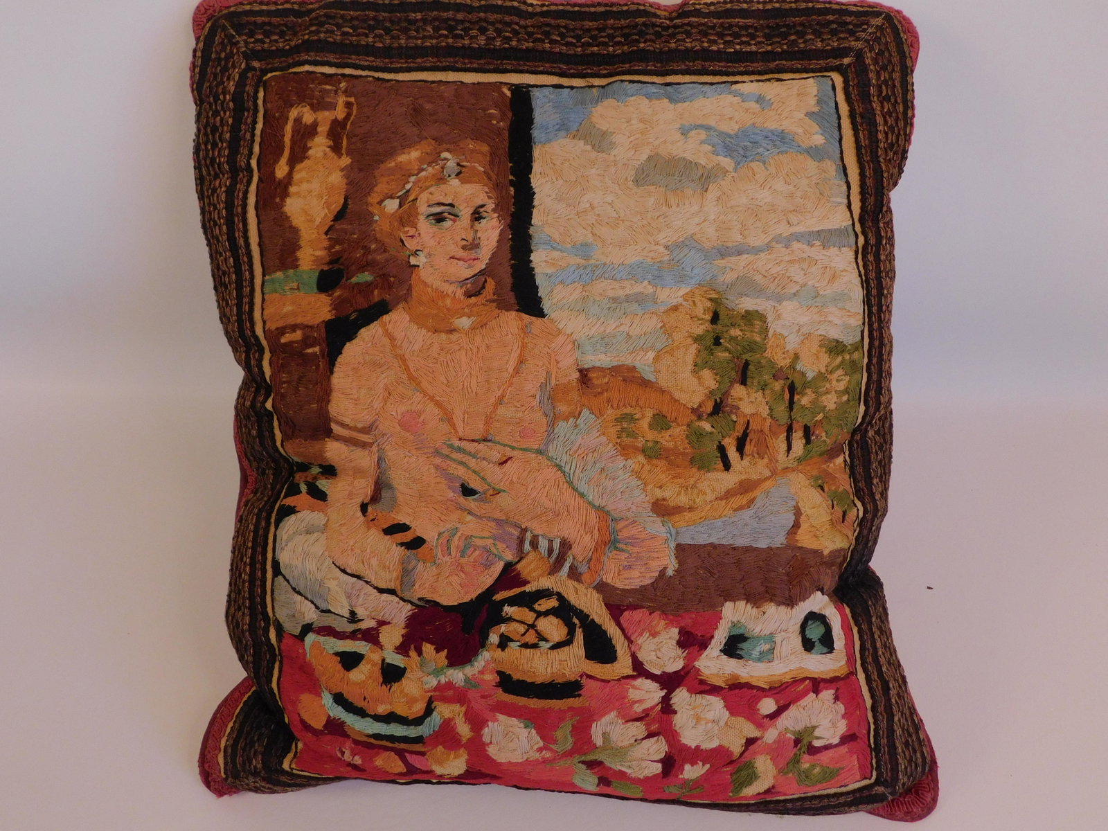 OLD CHENILLE PICTORIAL PILLOW: Old hand crafted and embroidered chenille pillow with classical scene of semi-nude woman by table and open window. 17 x 16 inches.