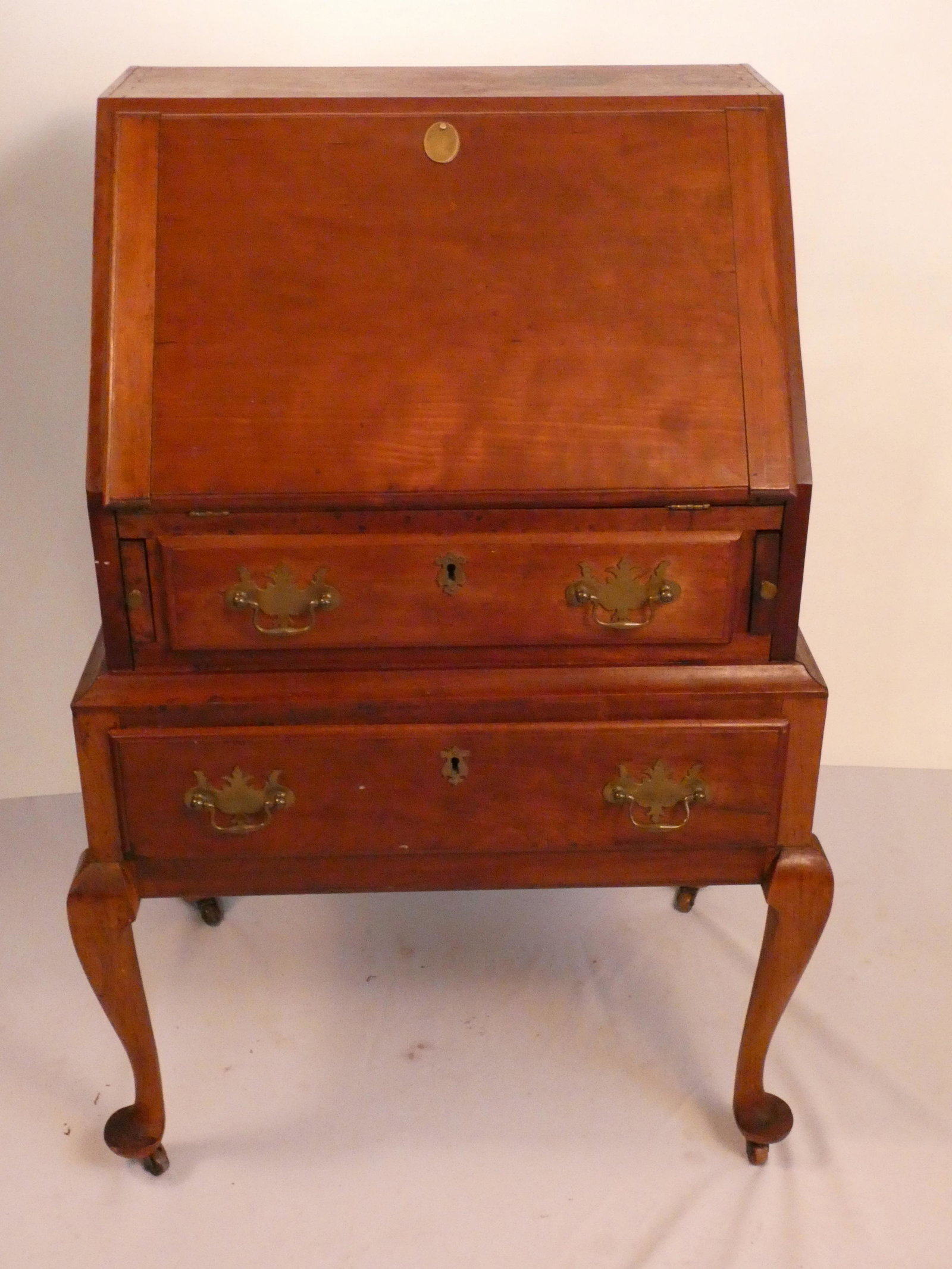 19TH C. QUEEN ANN LADIES DESK SLANT FRONT: Circa 1880 New England Queen Ann ladies mahogany slant front desk with 2 drawers. Has label with provenance on back. 39.5 in high x 27 w x 19 deep.
