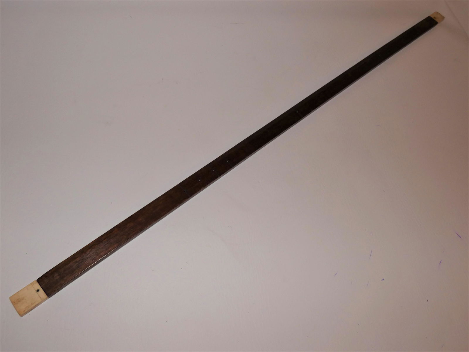 ANTIQUE WOOD & BONE YARD STICK: 19th century whale bone and wood yard stick with hash marks at 1, 9, 10, 11, 12, 18, and 27 inches. Probably for measuring barrels. 36 in long and 1 in wide.