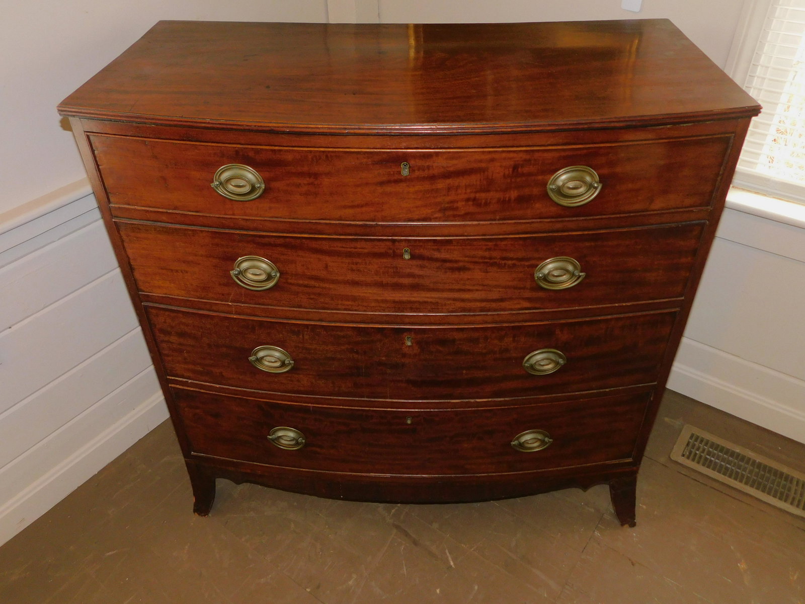 PERIOD HEPPLEWHITE MAHOGANY CHEST: Period Hepplewhite No. Shore Mass. bow front mahogany chest with oval brasses, 39 high x 40 w x 20.5 deep.
