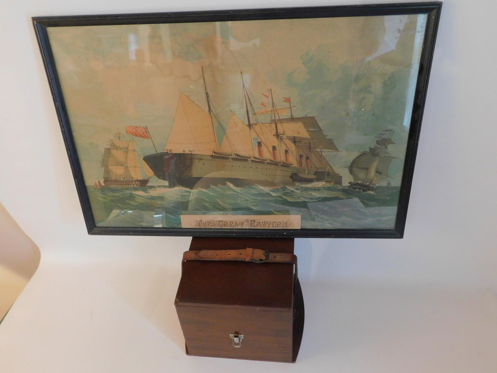 CHRONOMETER CASE & SHIP PRINT: Old wood ship's chronometer case with leather strap, 9 x 8 x 8 inches; together with a colored ship lithograph THE GREAT EASTERN, 18 x 27 inches (stains).