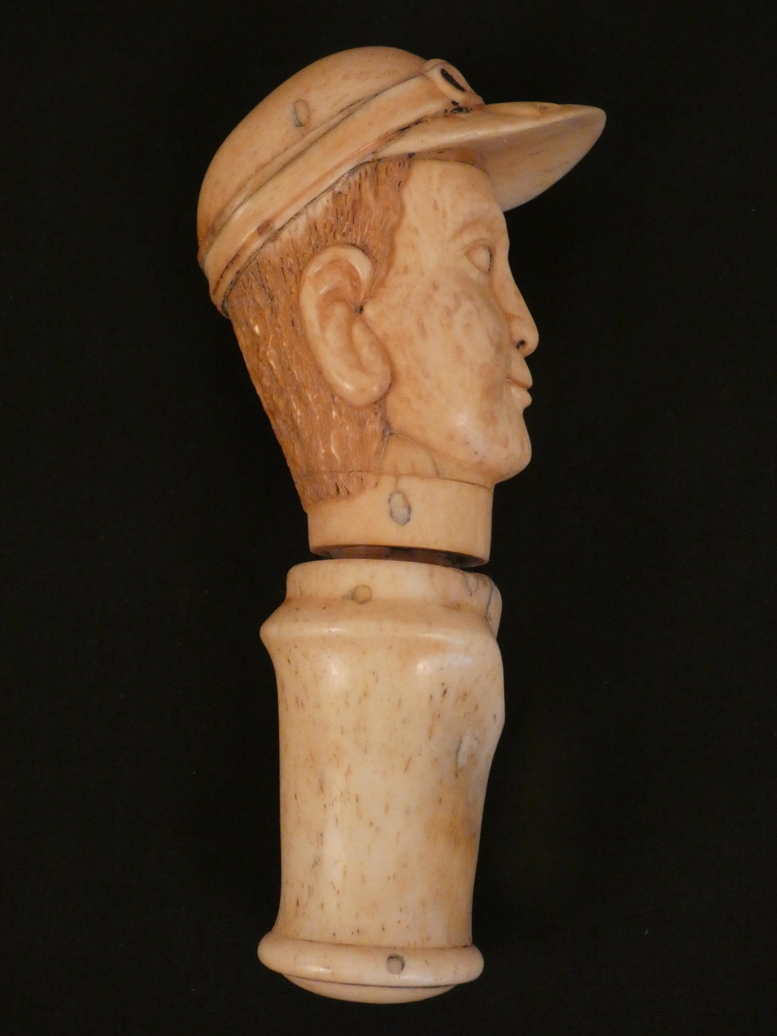 RARE BONE BOTTLE OPENER - JOCKEY: Rare 19th century carved bone beer bottle opener in the form of a jockey (bust). 4.5 in long, 1.25 in diameter. VG condition.