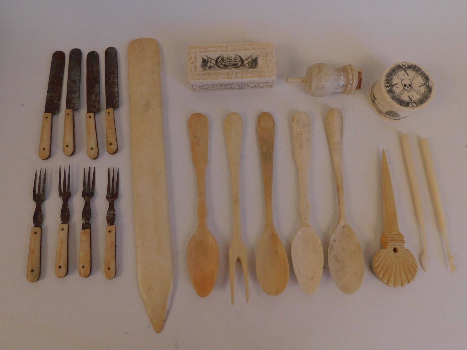 LOT WHALE BONE IMPLEMENTS ETC: 20 pieces of antique carved whale bone including flatware, 2 boxes, whistle, 9 in letter opener, 3.5 inch mini flatware.