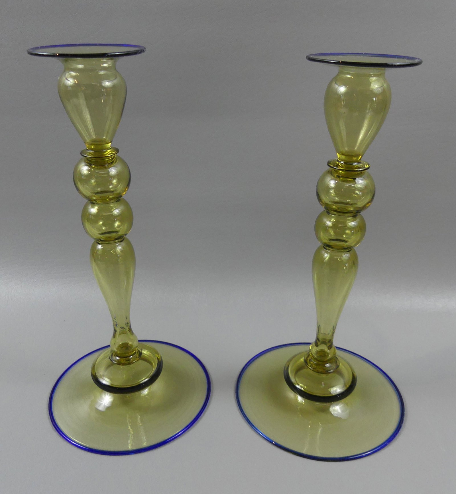 STEUBEN LARGE 2 COLOR CANDLESTICKS: Pair of large Steuben art glass 2 color blown glass candlesticks, shape number 2956, in rare large size of 11.75" tall. Both in excellent condition.