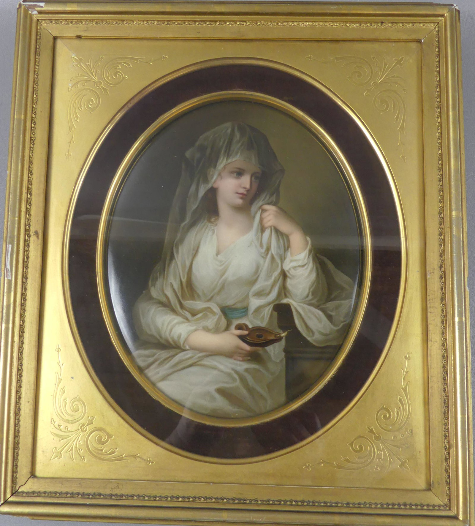 KPM PORCELAIN PLAQUE - VESTAL VIRGIN & LAMP: Large antique KPM Germany oval hand painted plaque depicting the Vestal Virgin with Lamp. Plaque stamped KPM 5 and is 10.5 x 8.5 inches, in gilt frame under glass 16 x 14 inches. Excellent condition w