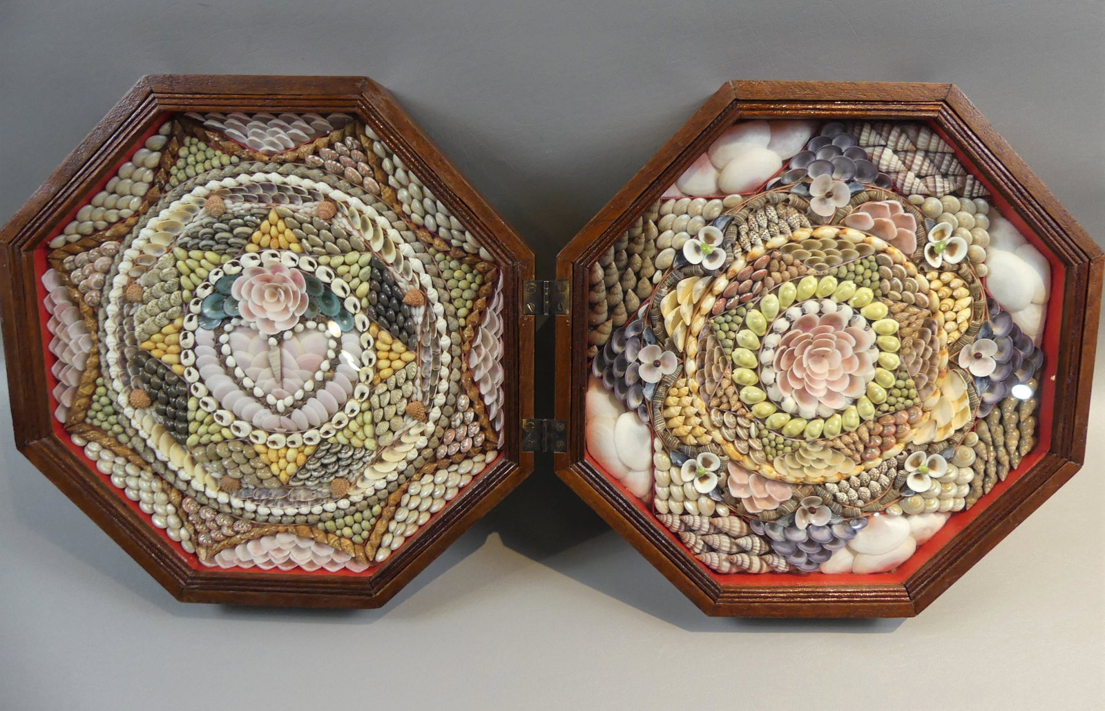 SAILOR DOUBLE SHELL VALENTINE: Sailor made double shell valentine in folding hexagonal walnut case. 12 inches by 4 in deep when closed.