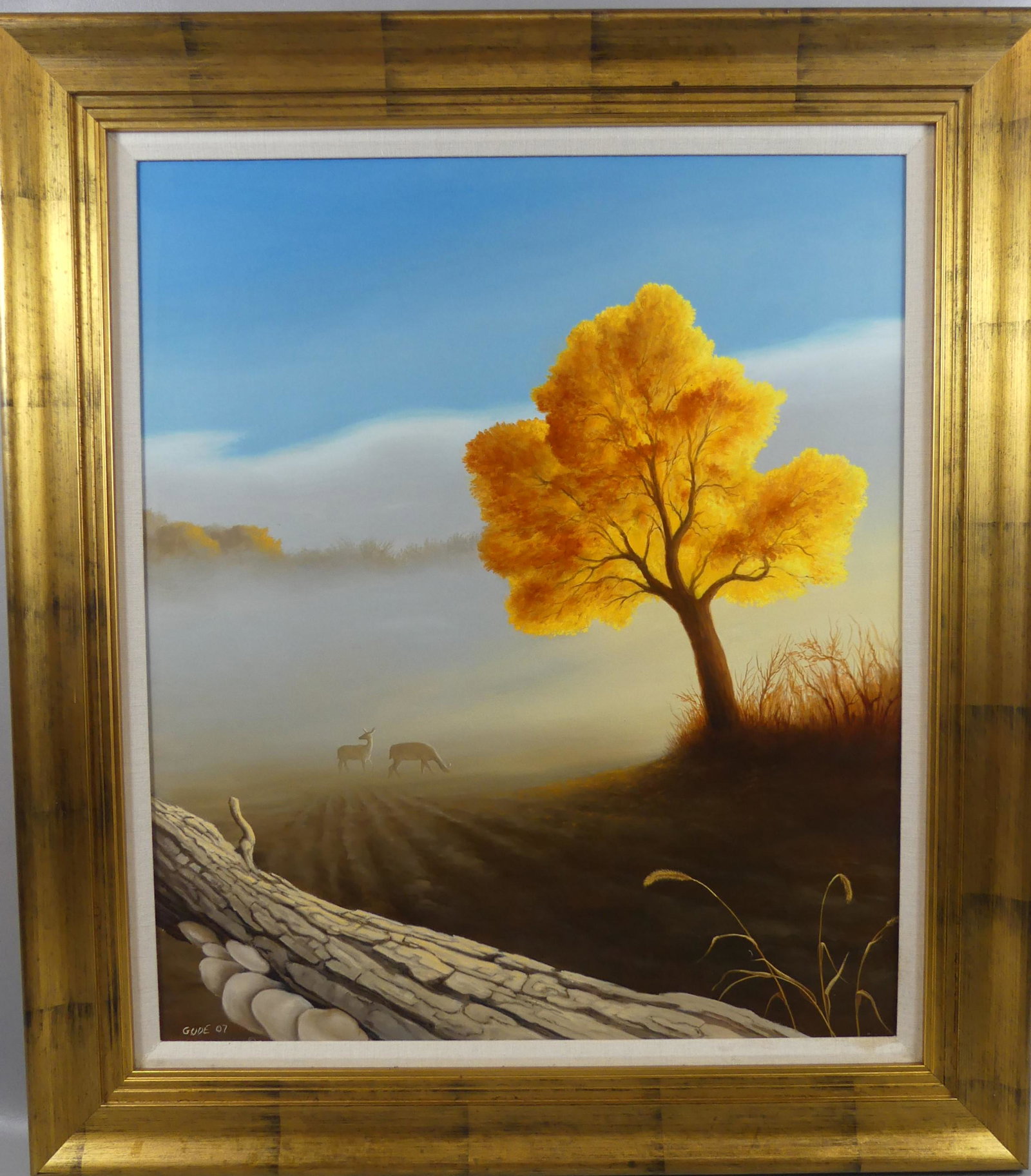 ANTHONY BENTON GUDE PAINTING - DEER IN MIST: Oil painting on masonite of a landscape with deer in the mist and a brightly colored tree signed GUDE '07 and titled verso MORNING FOG. Size: 28 x 24 inches, framed 35 x 31. Deaccessed from the Midwes