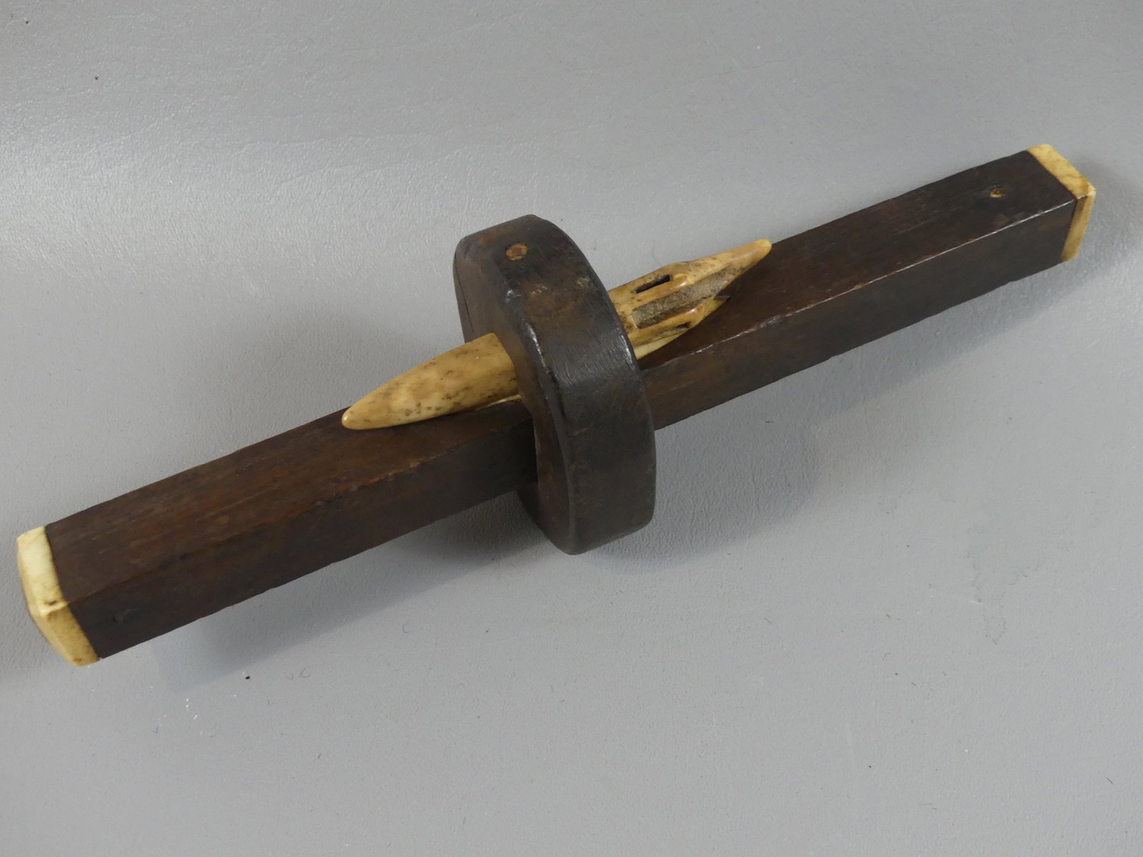 SAILOR MADE CARPENTER SCRIBE: 19th century sailor-made hardwood and bone carpenter's scribe tool, 10 in long.