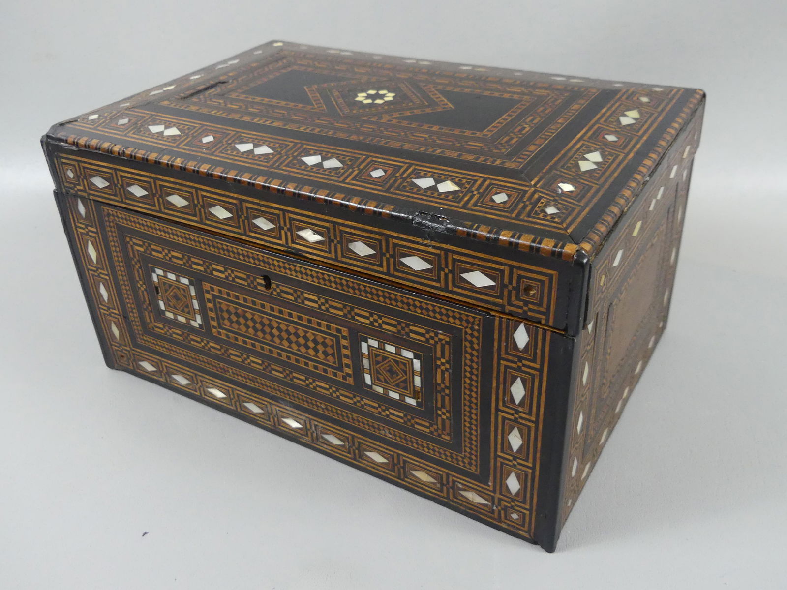ANGLO-INDIAN INLAID BOX: 19th century Anglo-Indian inlaid box with interior mirror and abalone shell & elaborate wood inlay. 11.5 x 7.5 x 6.5 inches. Minor loss to inlay.