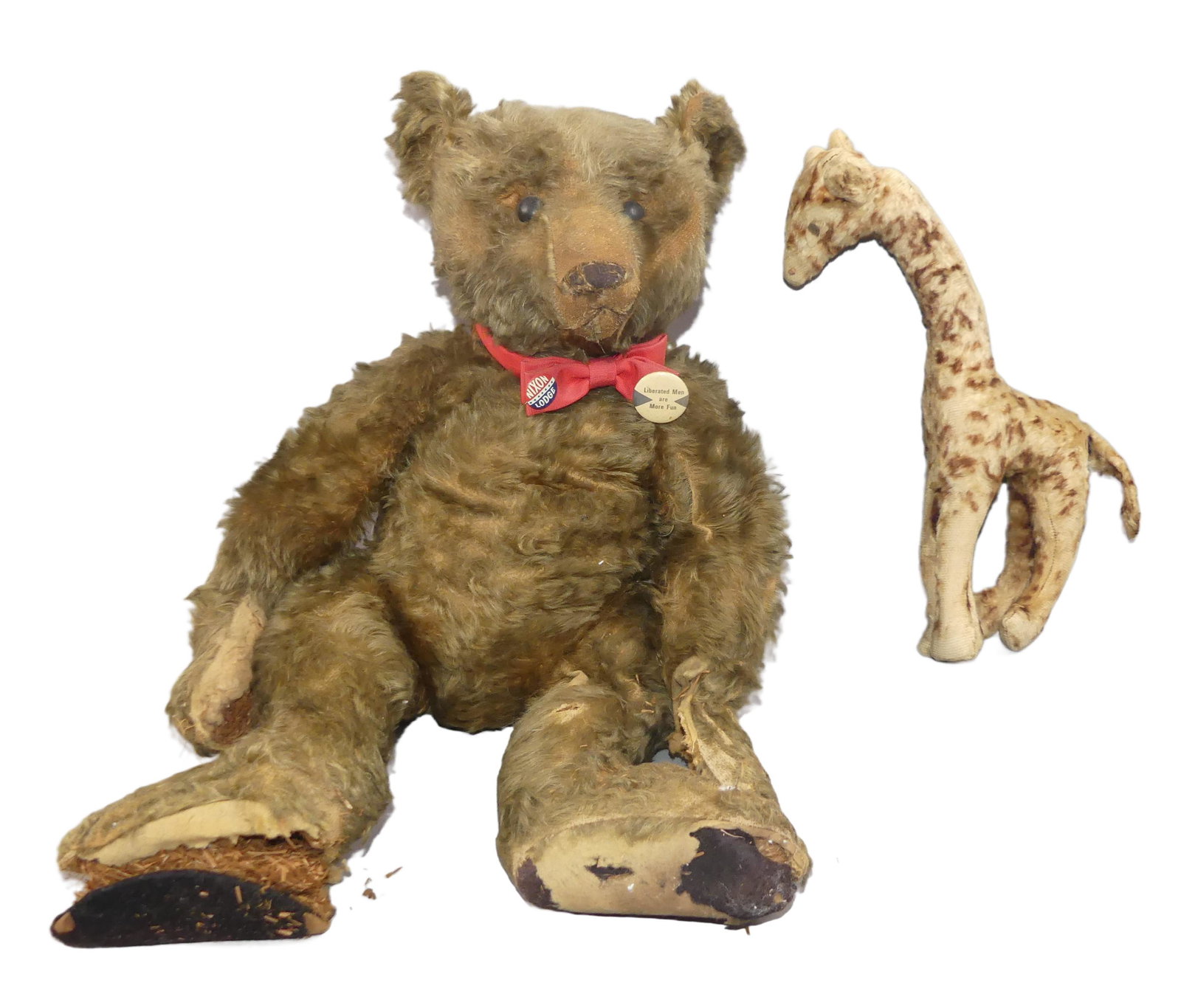 EARLY STEIFF BEAR & GIRAFFE: A very early Steiff mohair teddy bear, 21 in long, black shoe button eyes. Sold in as is condition with wear and needing restoration to paws and feet. Together with a Steiff giraffe, 14 in tall, some 