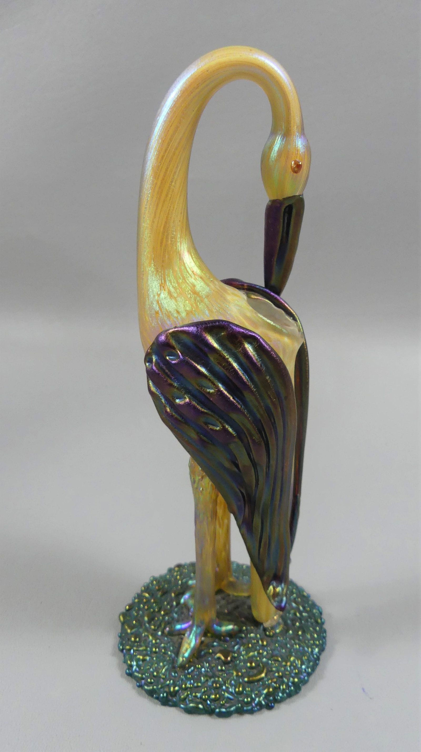 RARE LOETZ ART GLASS STORK VASE: Rare Bohemian art glass figural vase of a preening stork by Loetz (unsigned as typical). Multiple iridescent colors including gold, green, and amethyst. 8 in tall by 3 in across base. Perfect conditio