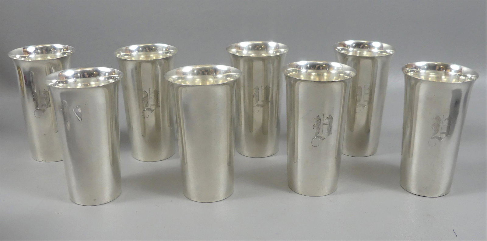 SET 8 STERLING MINT JULEP CUPS: Set of 8 sterling silver Mint Julep cups or goblets, 6 with light monogram, 5.25 in tall by 3 in wide. Total weight 40 ozt. Couple minor dents. American hallmark.