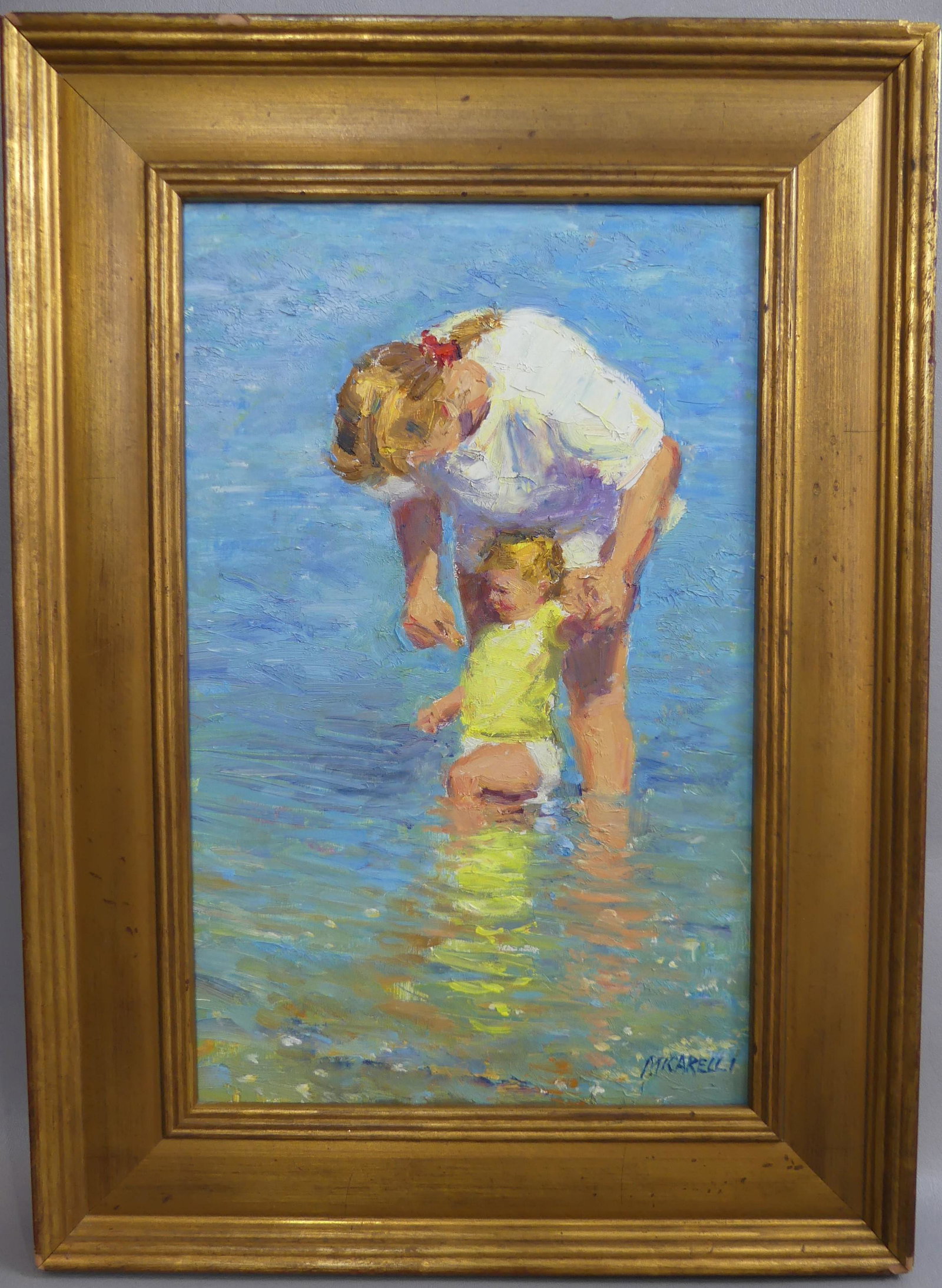 MICARELLI BEACH SCENE PAINTING: Vintage Impressionist oil painting on wood panel depicting a mother and child playing in the ocean signed Micarelli. 16 x 10 in, framed 21 x 15 in. (Clemente Micarelli 1929-2008 was an American artist