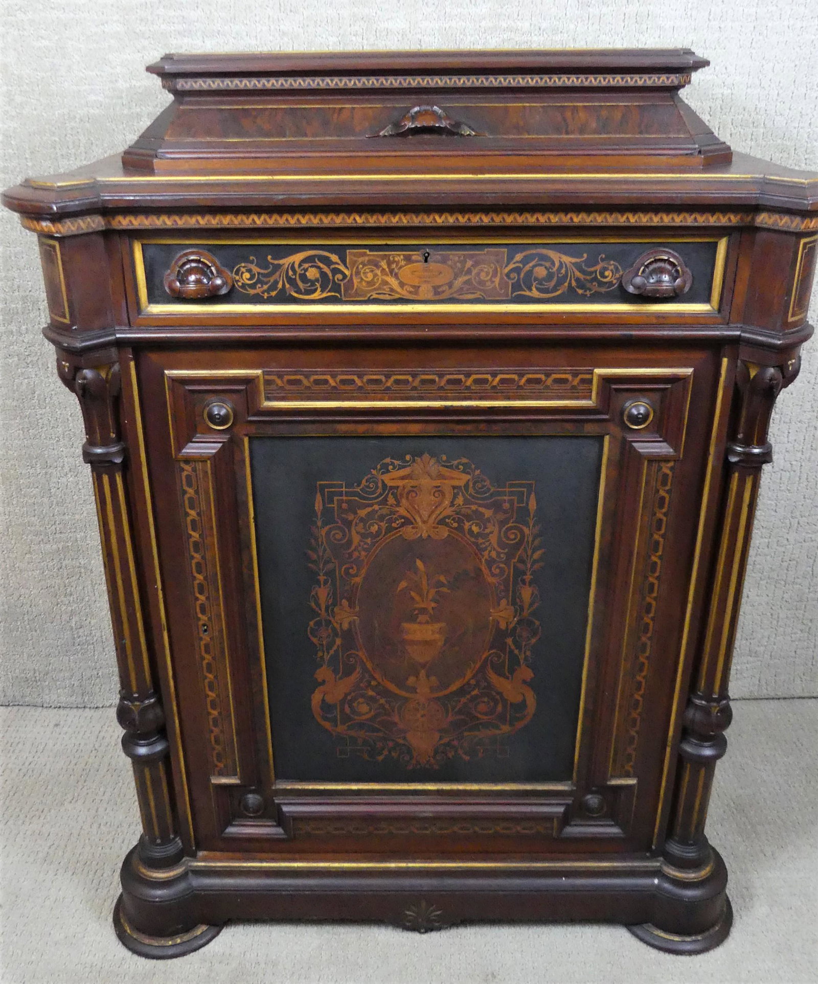 VICTORIAN INLAID CABINET ATTR. HERTER: Outstanding Victorian walnut Renaissance Revival inlaid parlor cabinet attributed Herter Bros. or Pottier & Stymus. Has center doored compartment with one shelf and two upper drawers. Classical inlay