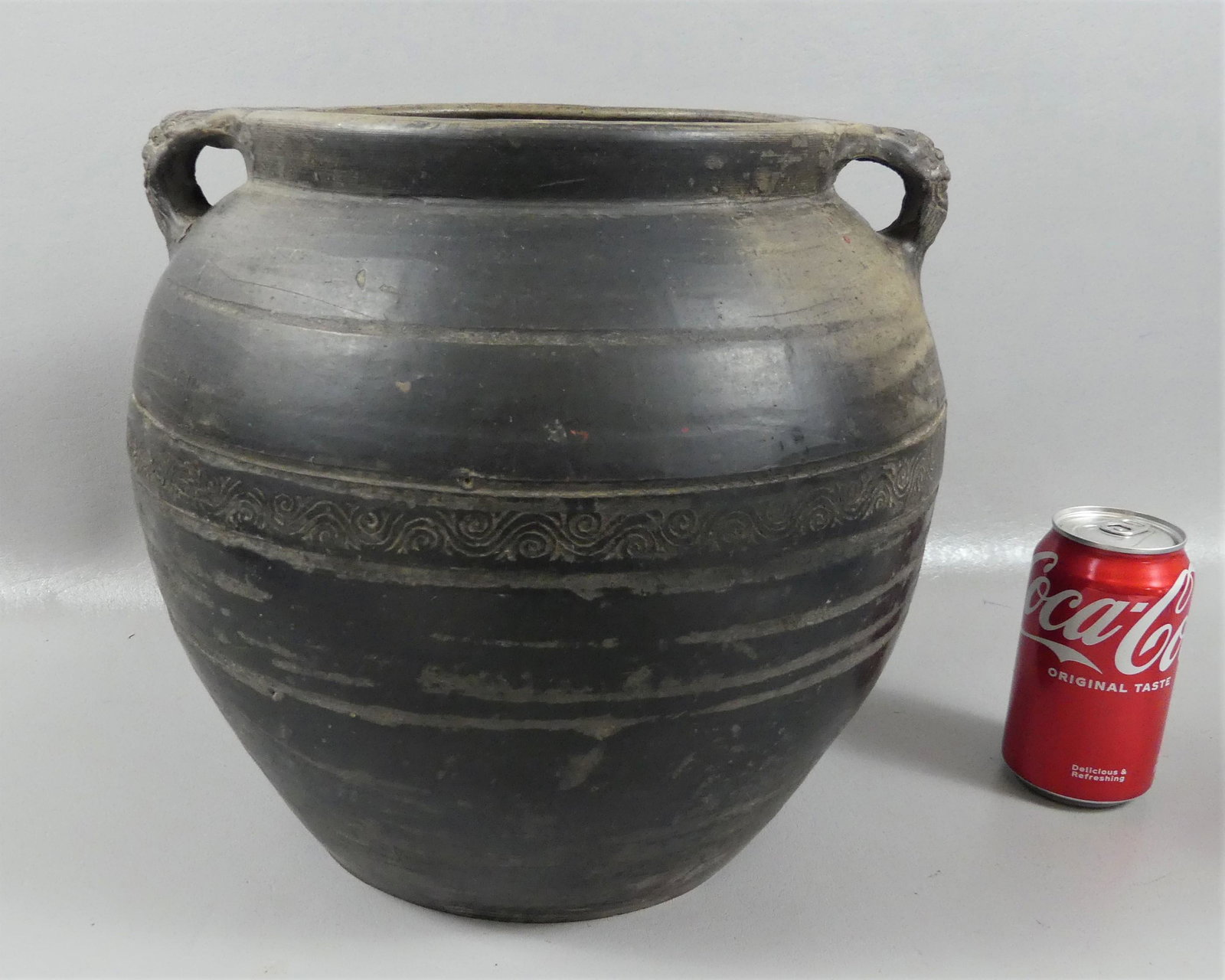 HAN DYNASTY CHINESE POTTERY POT: Early Chinese brown pottery or proto-porcelain handled pot (masks) circa 100AD. 11 in high x 8 in across mouth. Authentic Han Dynasty - vg condition.