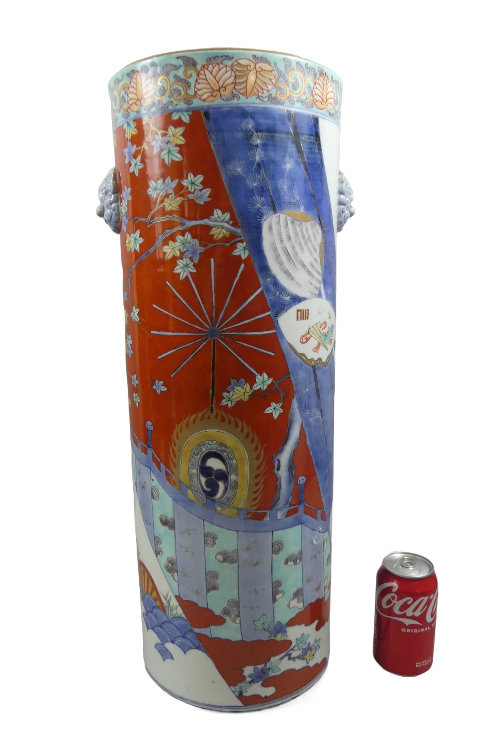 ANTIQUE JAPANESE UMBRELLA STAND - SIGNED: Unusual and colorful, Japanese Meiji period porcelain umbrella stand with embossed lion masks, landscapes, medallions with fans, flowers, etc. Signed on underside. 23.75 in hgih x 8.75 wide. Excellent