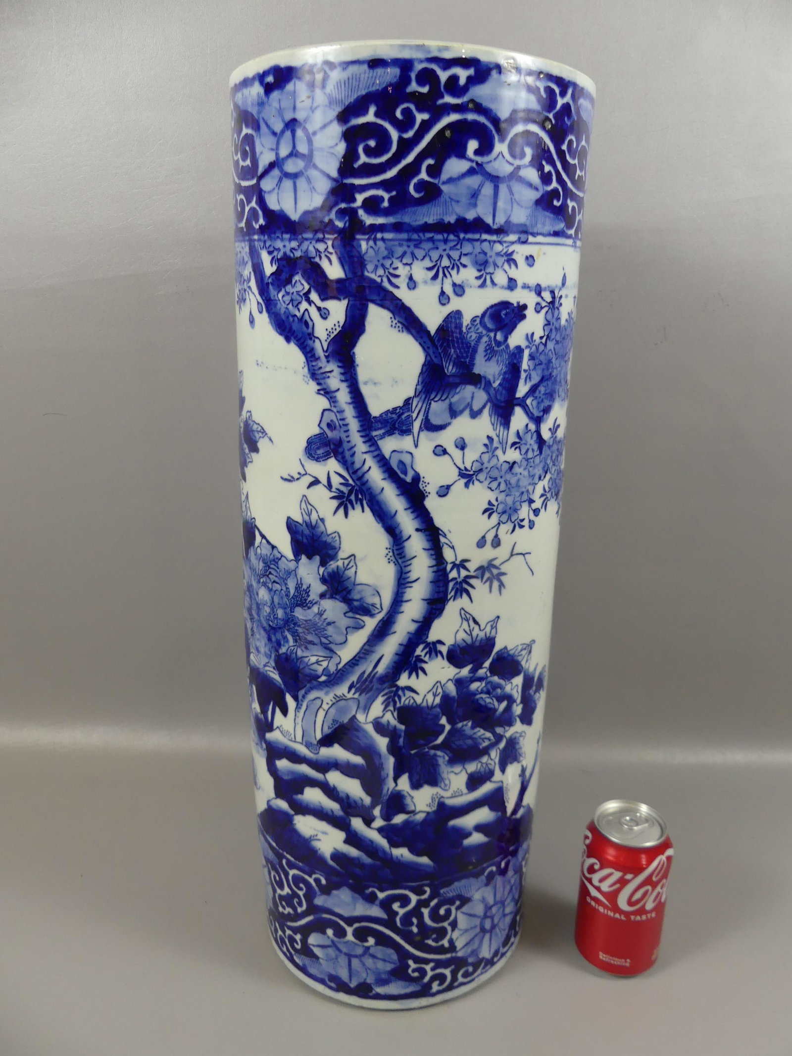 ANTIQUE JAPANESE UMBRELLA STAND: Antique Japanese porcelain blue and white umbrella stand with birds in landscape, unmarked. 24 in high by 8.5 in diam. Exc. condition.