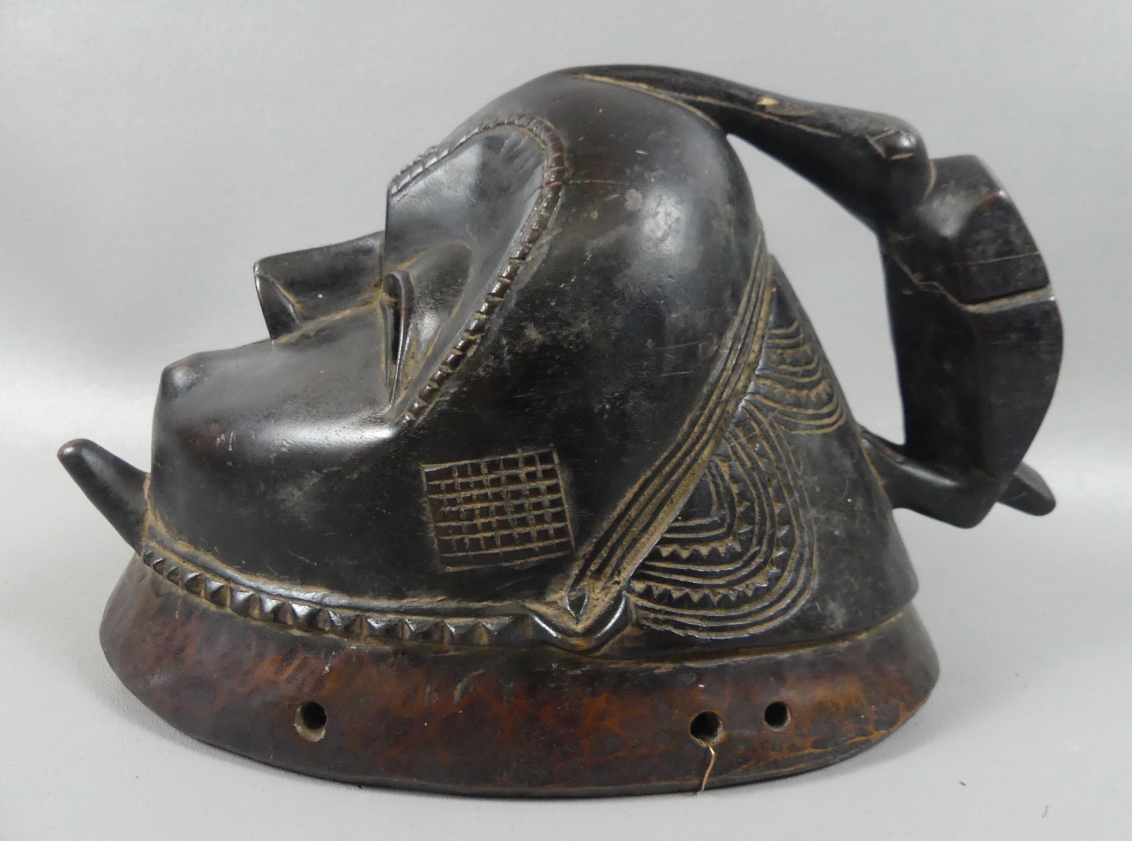 BAULE MBLO PORTRAIT MASK: Old African carved wood Baule mask for the Mblo ceremony with bird on female head. 12 in high, contraction crack on one side.