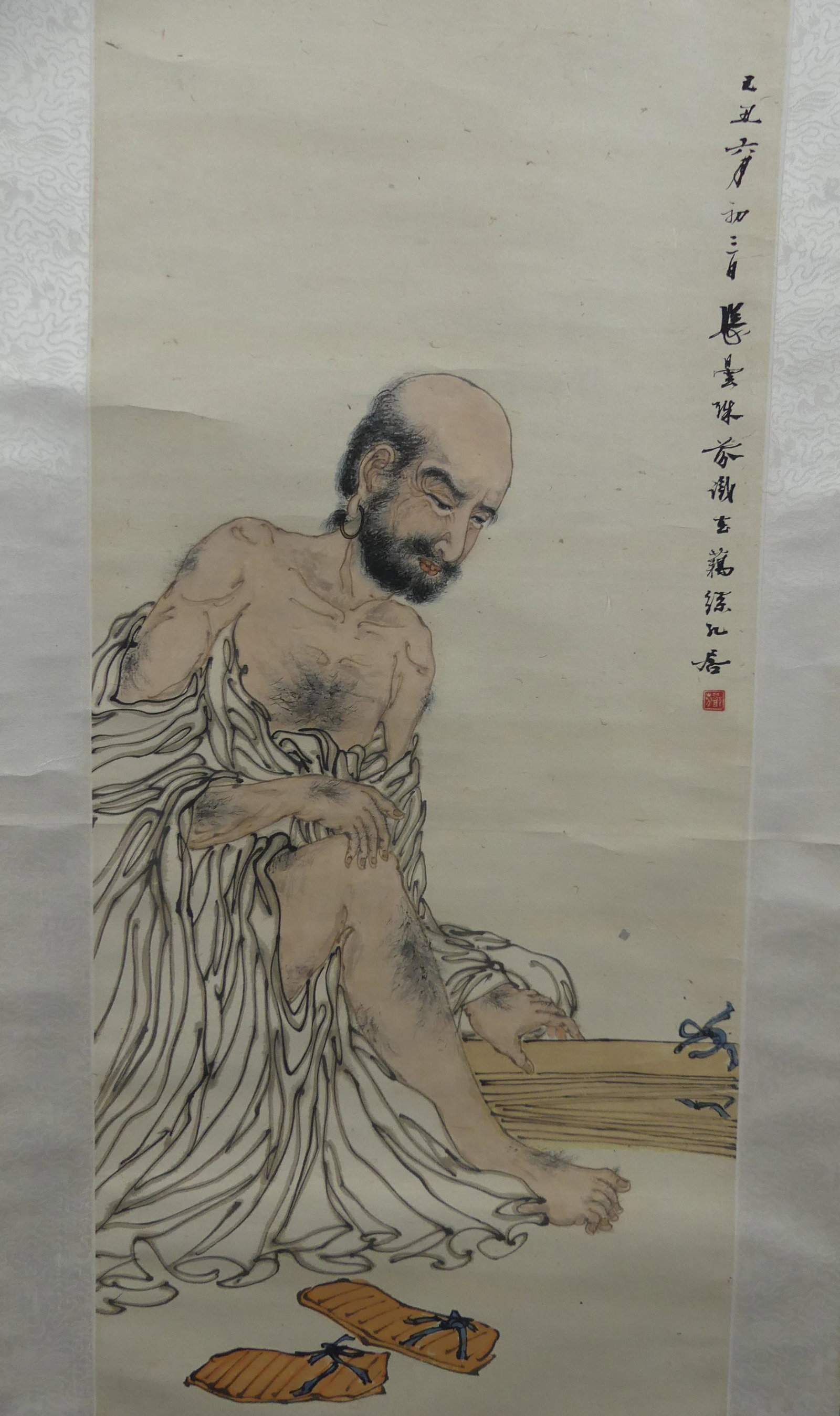 CHINESE SCROLL OF MAN BY TAN FAN: Old Chinese painted scroll of a bald man in loose robe with sandals, identified on label BUDDHIST, TAN FAN. 33 X 14.5 in, overall 76 x 19. Provenance: From the Al and Aiko Hydeman estate. NOTE: Albert
