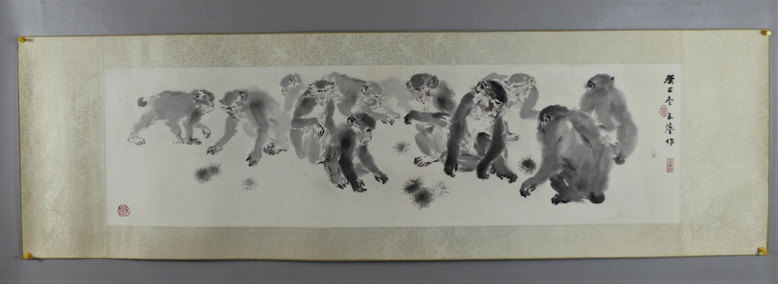 CHINESE INK PAINTING - MONKEYS BY YEUNG SIM-SUM: Wide format, old Chinese ink painting of 11 monkeys, label verso with title MONKEYS by YEUNG SIM-SUM (N). 10.5 X 38 in, overall 15 x 50 in. Unframed.Provenance: From the Al and Aiko Hydeman estate. NO