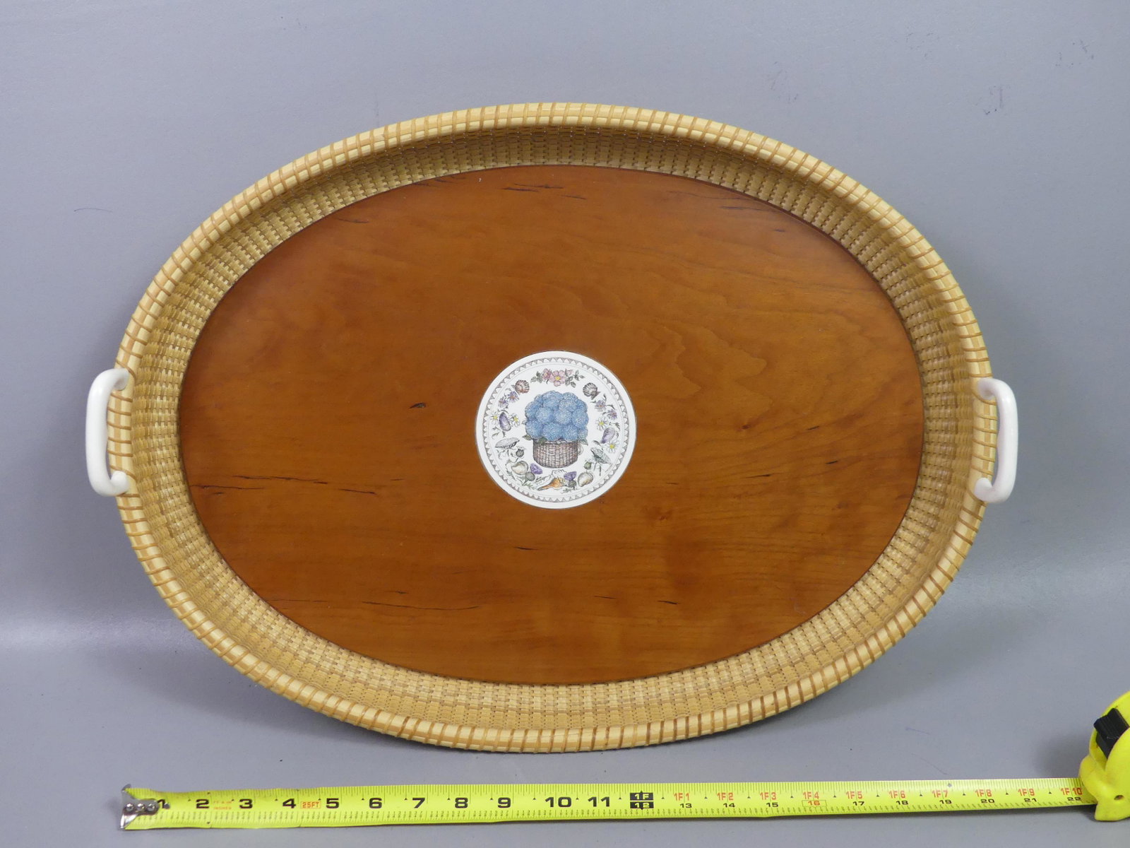 22 INCH NANTUCKET TRAY - CIFRANIC: Large woven Nantucket basket handled tray signed Richard Cifranic, Nanucket 1999. 22 x 16 x 2.5 in deep. Has circular 4 inch bone medallion with hydrangeas etc.