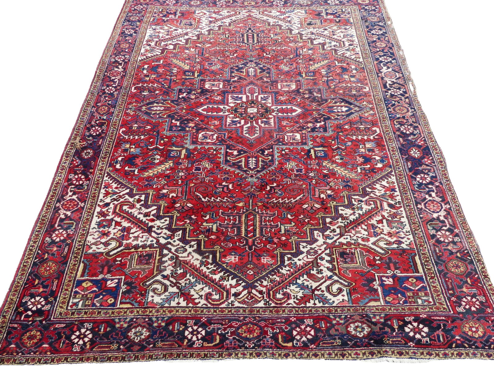 ANTIQUE HERIZ 9 X 12 CARPET: Semi-antique Heriz room size rug, 9 x 12 feet. Wear to 12 inch area on one end.