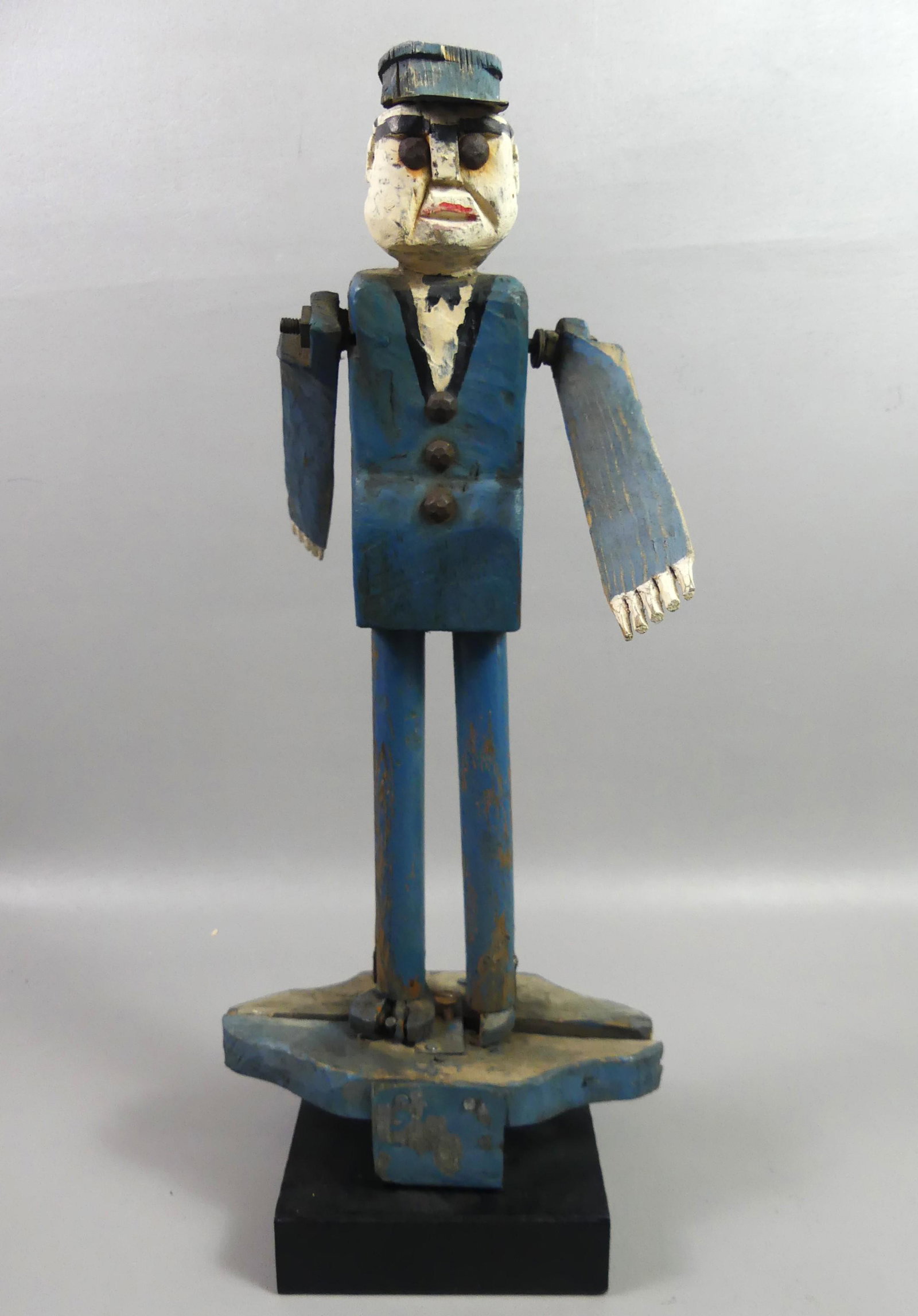FOLK ART WOODEN POLICEMAN WHIRLIGIG: Antique folk art carved and painted wood whirligig of a policeman, 19 in tall. Some imperfections.