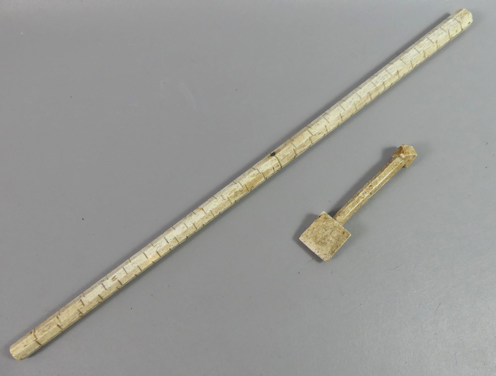 WHALE BONE SEAMER & MEASURE: Two 19th century whale bone items: 24 in long cask measuring stick, and a 6.25 in seam rubber for sails. Both from Nantucket sea captain's home.