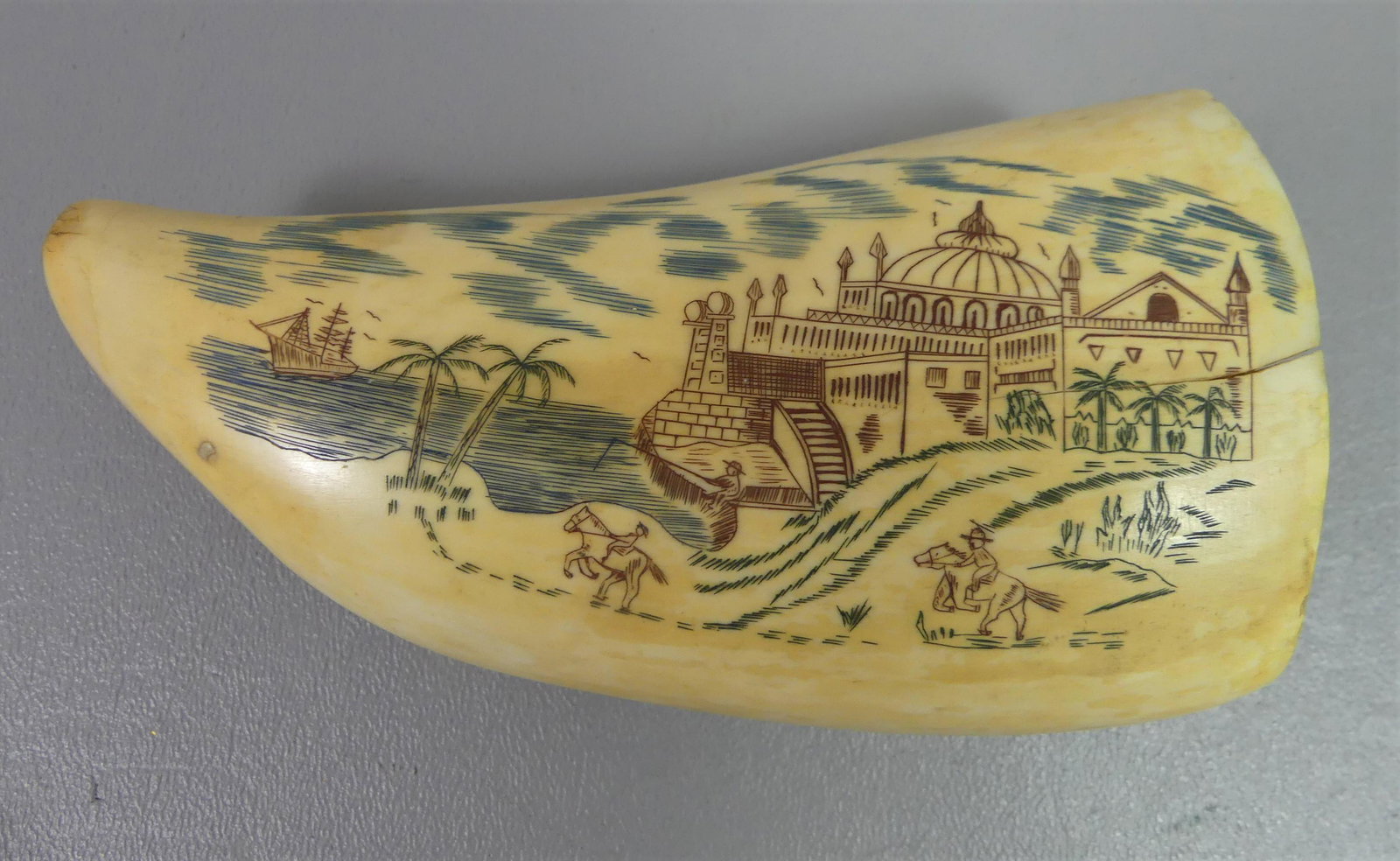 WHALE TOOTH W/MID EAST SCENE: Large antique whale tooth with later colored scrimshaw of a Middle Eastern scene, 5.25 in by 2.75 in. Weighs 13 oz.