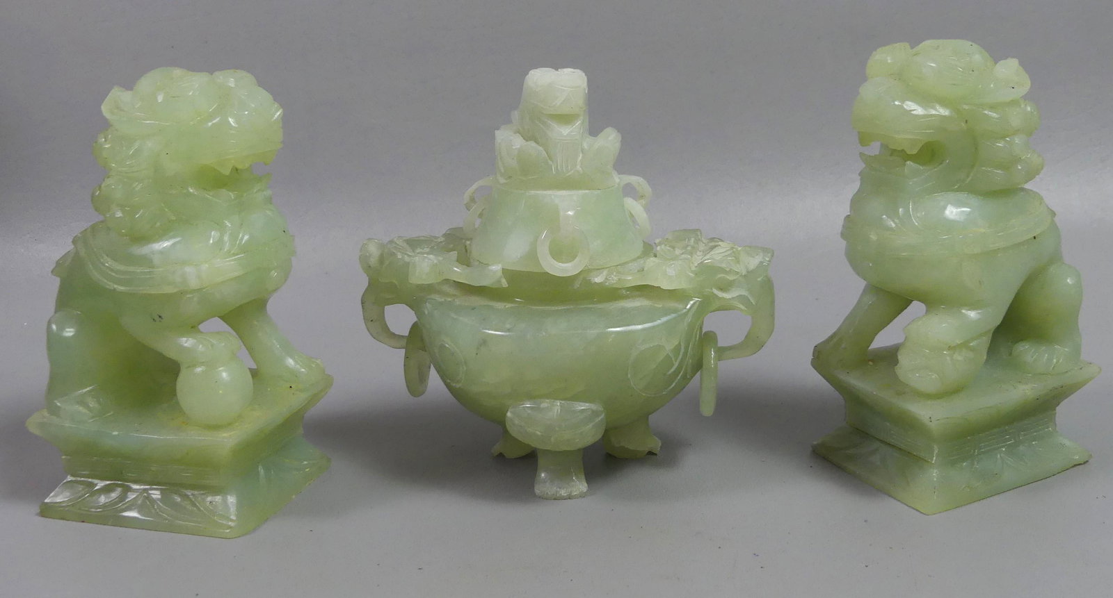 3 CHINESE QUARTZ ITEMS: Lot 3 old Chinese green quartz carved items: Pair foo dogs, 5.5 in high; and a covered, trifoot censer bowl with elephant handles and rings, 5.5 in high. Provenance: Ex-collection of Helga Wall-Apelt.