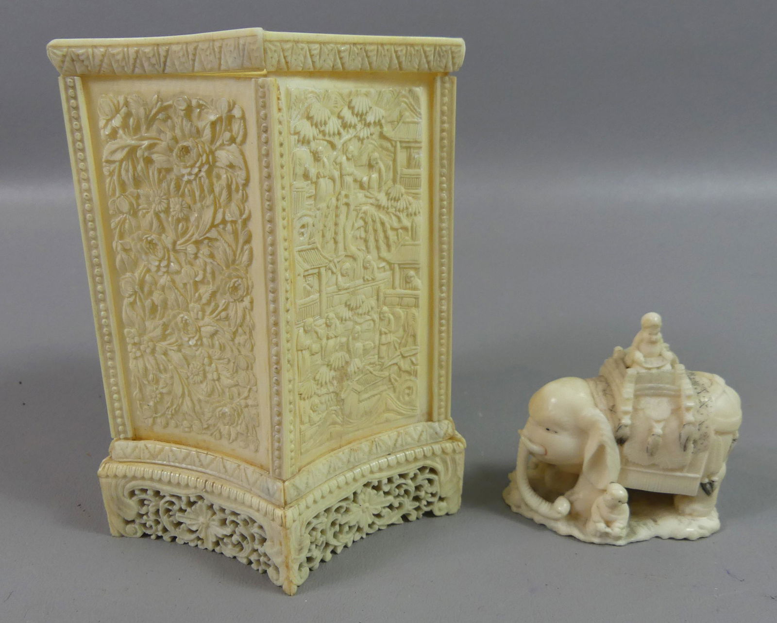 JAPANESE CARVED BOX & ELEPHANT: 2 fine carved bone Japanese Meiji pieces: hexagonal concave-sided box with fish, flowers, and genre scenes (crack), 5 x 4 inches, and a miniature elephant with 3 figures and animals, 2.5 x 2.5 in.
