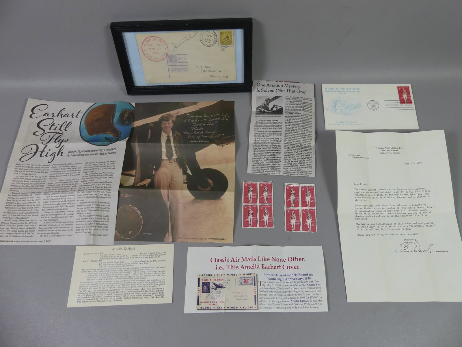 AMELIA EARHART 1932 AUTOGRAPH LOT: Original signed 1932 National Air Races in Cleveland Ohio envelope (framed) with autograph of Amelia Earhart. Plus First Day Cover and 8 Air Mail Stamps (8c) with her image. Included are some articles