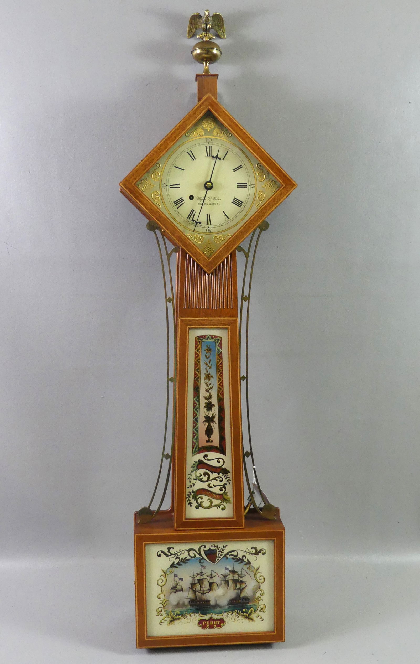 WAYNE CLINE DIAMOND HEAD BANJO CLOCK: Fine quality vintage weight driven banjo clock signed Wayne R. Cline, Bowling Green KY with scarce diamond head, 6 in dial, reverse painted table PERRY with naval battle (signed Moberg and #36 inside)