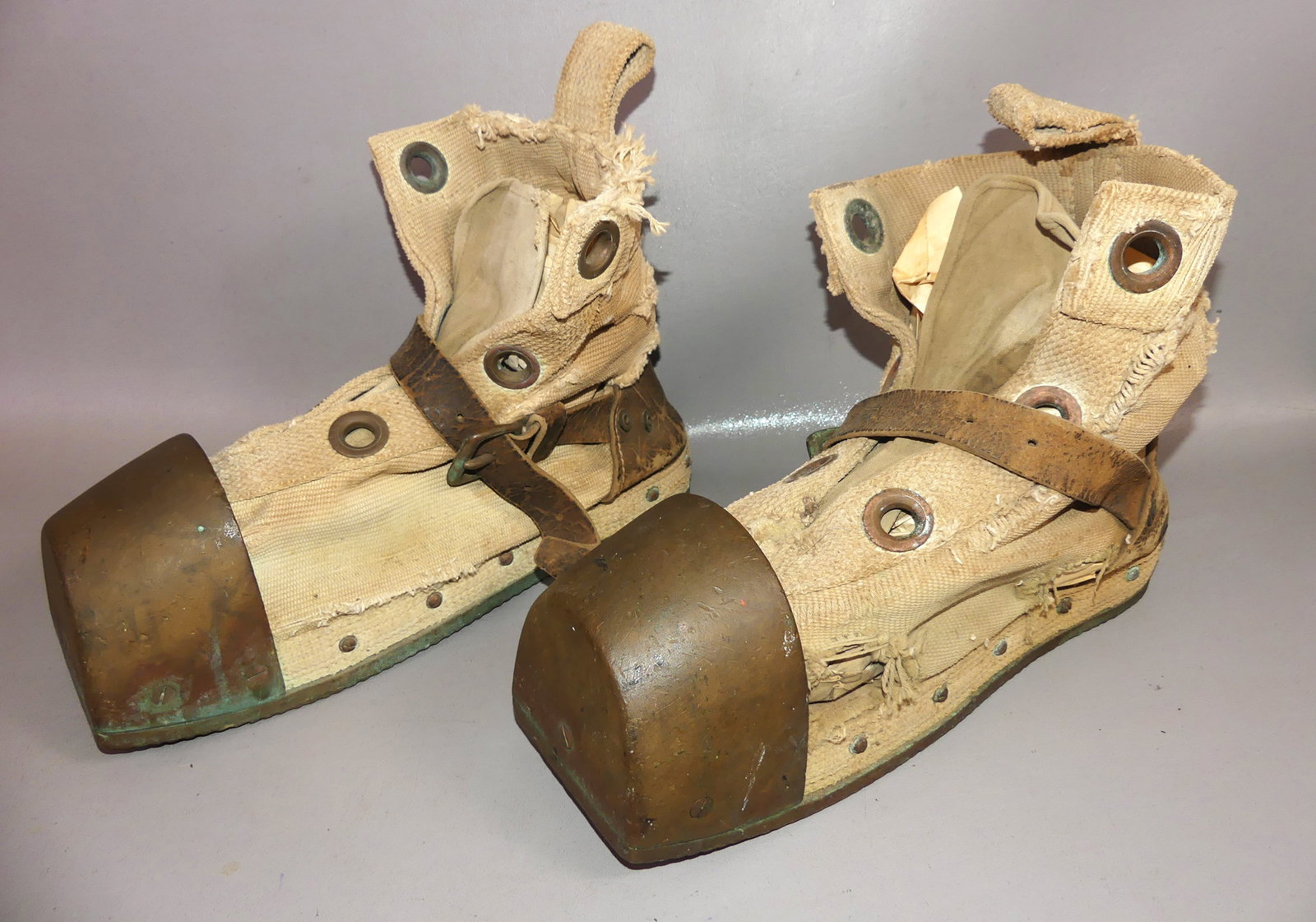 ANTIQUE BRONZE & CANVAS DIVING BOOTS: Pair antique heavy bronze, canvas, and leather deep sea diving boots, 14 in long. Some damage to canvas.
