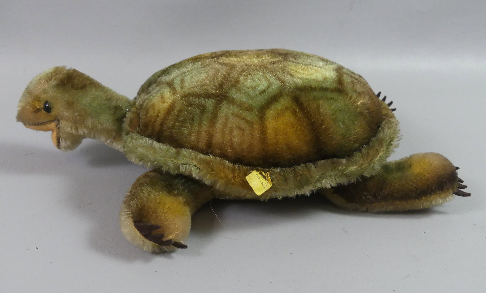 OLD STEIFF TURTLE: Old Steiff stuffed turtle with original metal ear tag. Size: 13 x 10 in.