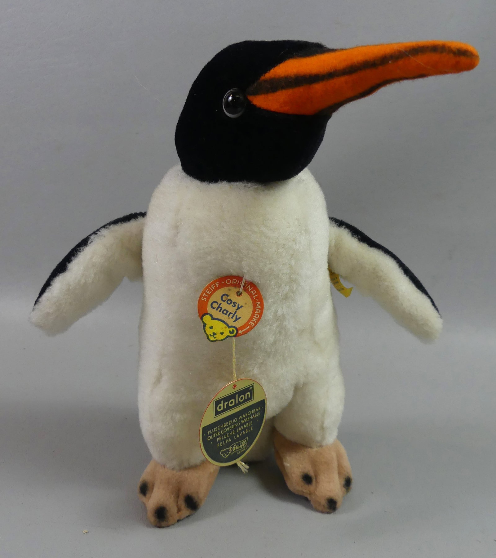 OLD STEIFF PENGUIN CHARLY: Old Steiff stuffed penguin named COSY CHARLY with original paper tag and metal ear tag. Size: 10 in.