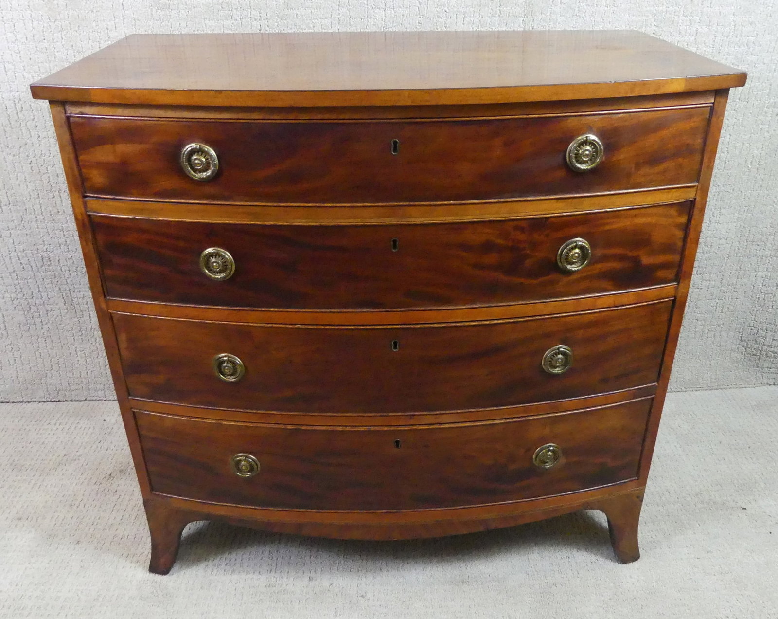 HEPPLEWHITE BOW FRONT PERIOD CHEST: Period American Hepplewhite 4 drawer bow-front chest, minor veneer loss. 38 in wide x 38 high x 21 in deep.