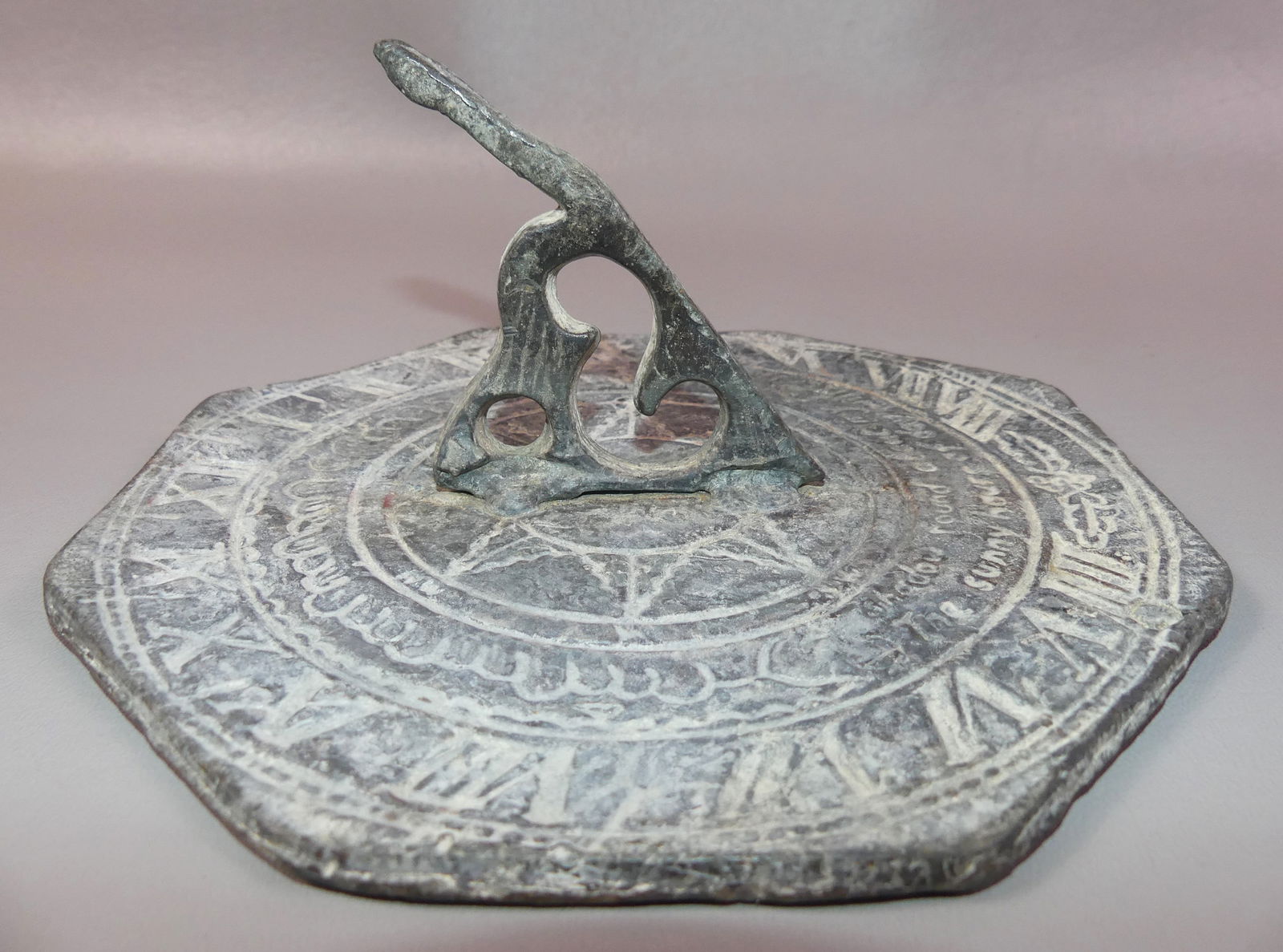 CA. 1800 PEWTER SUNDIAL: Antique pewter/lead sundial circa 1800 with legend --A Shadow Round About My Face, The Sunny Hours of Day Will Trace. 8 x 3 inches.