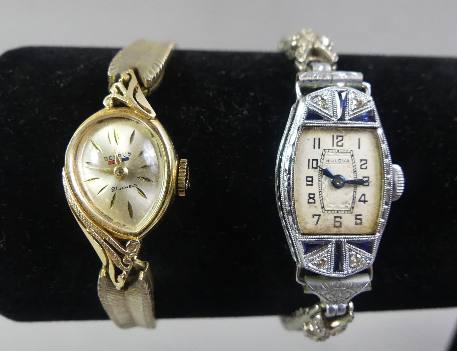 14K GOLD BENRUS & BULOVA LADIES WATCHES: Lot 2 vintage watches in original boxes: 14k white gold Art Deco Bulova watch with tiny sapphire and diamond inset case, gold-filled flex band; and 14k Benrus with gold-filled band, 3/4 in teardrop di